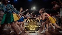 a group of people dancing on a stage with the words savoy cup final