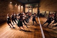 a group of people in a dance studio